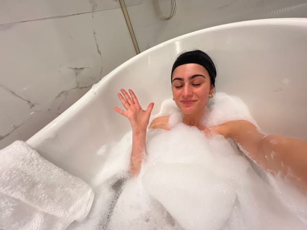 Woman enjoys bubble bath in Spa, Belgium