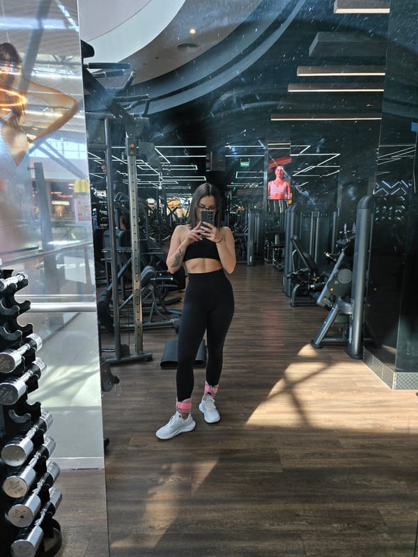 Woman takes gym mirror selfie in Burgas, Bulgaria