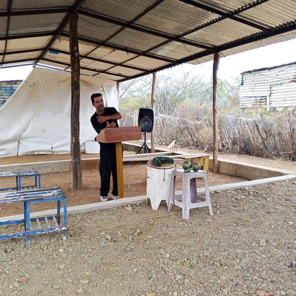 Daily life scenes: outdoor speech, beached boats, gas station