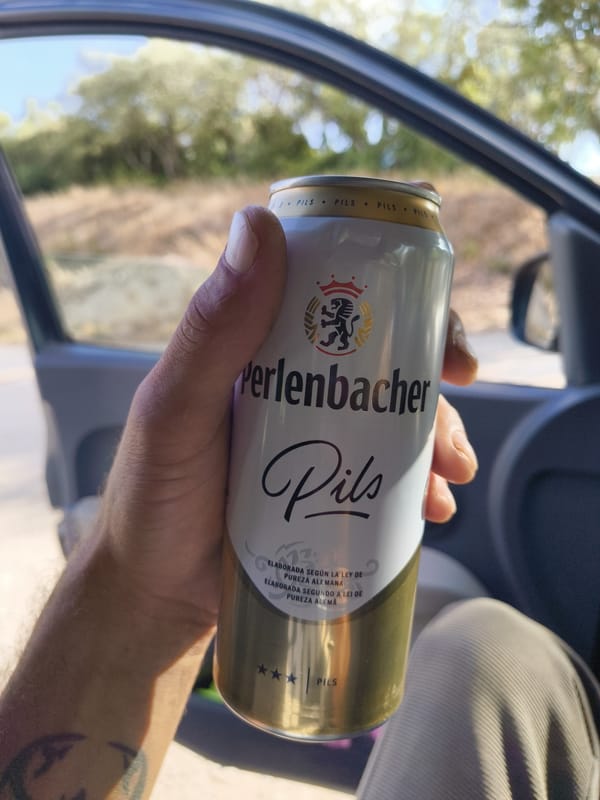 Afternoon hangout in a dusty Oeiras parking lot, beer in hand