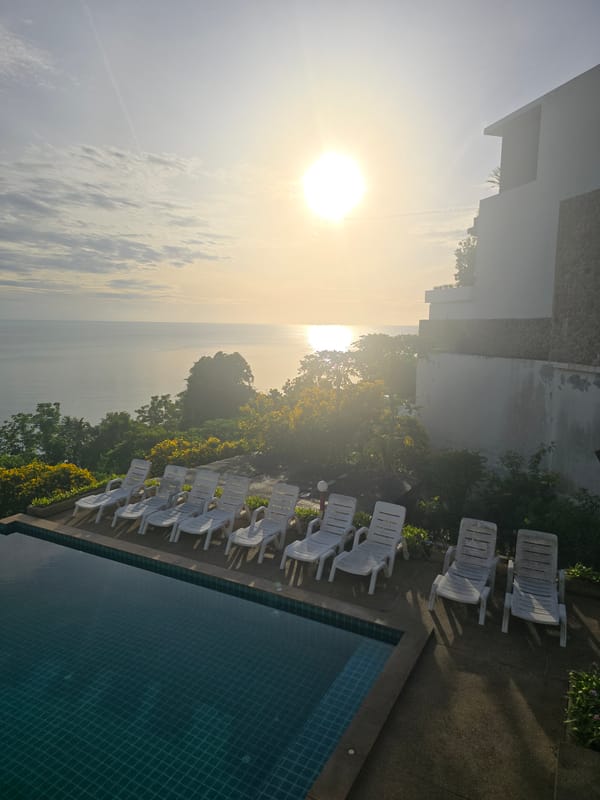 Infinity pool overlooking the ocean, golden light, no one around