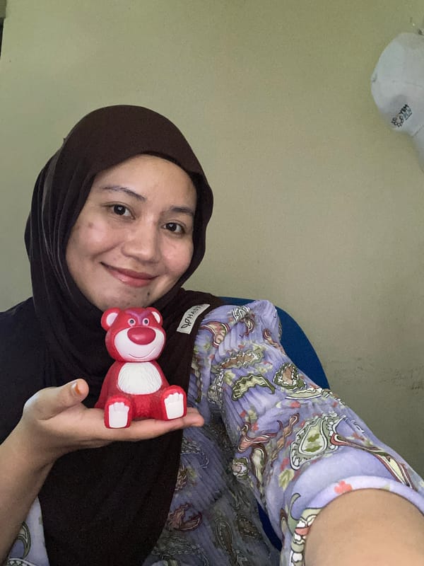 Playful selfie session in Banjarbaru with a Lotso bear
