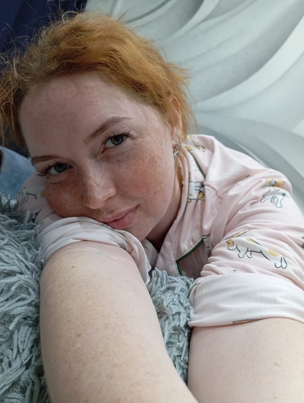 Woman in cat pajamas photographed resting indoors in Yurgamysh