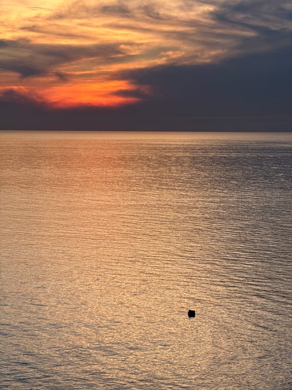 Sunset over anchored fishing boats off Lý Sơn Island