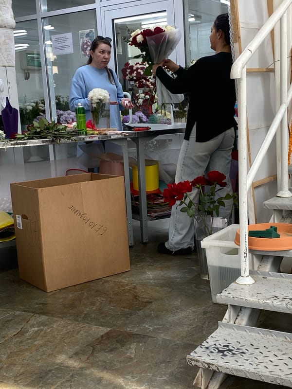 Florist arranges bouquets at Yekaterinburg flower shop Thursday morning