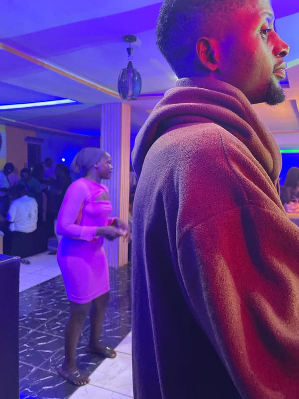 Social gathering at illuminated lounge in Durimi, Nigeria