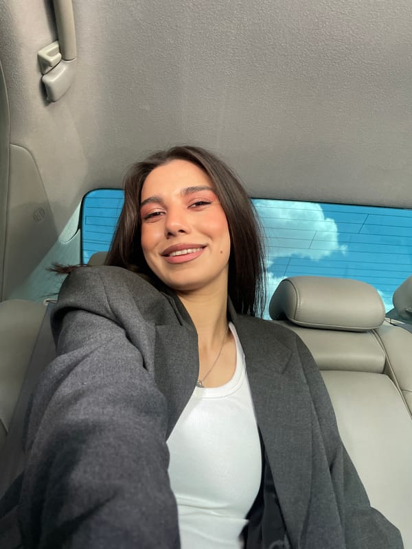 Woman smiles in car in Yerevan, Armenia