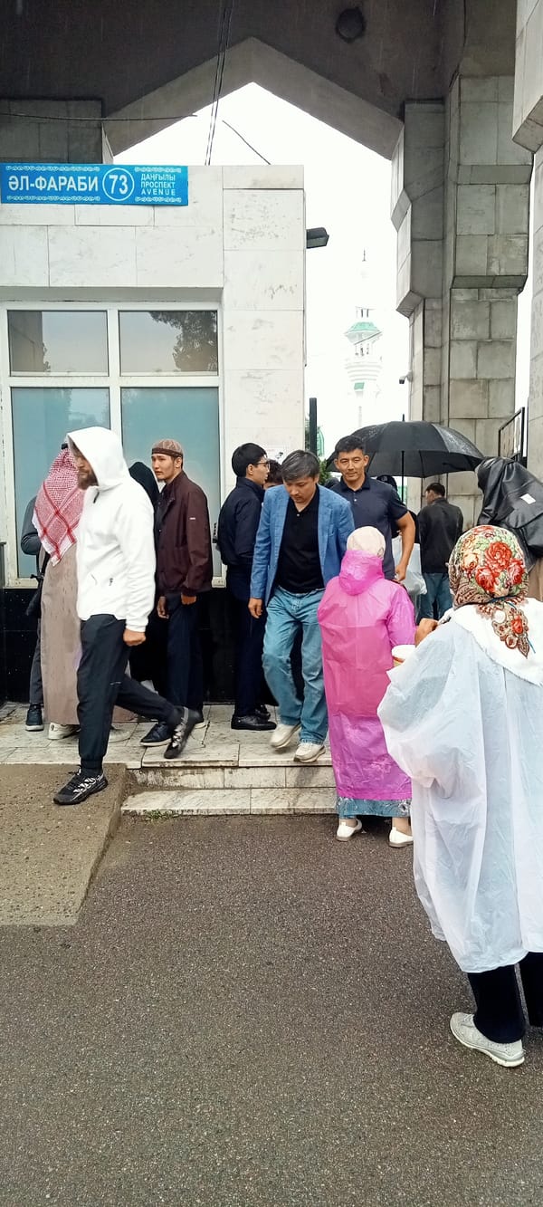 Rainy morning gathering at Almaty's Central Mosque