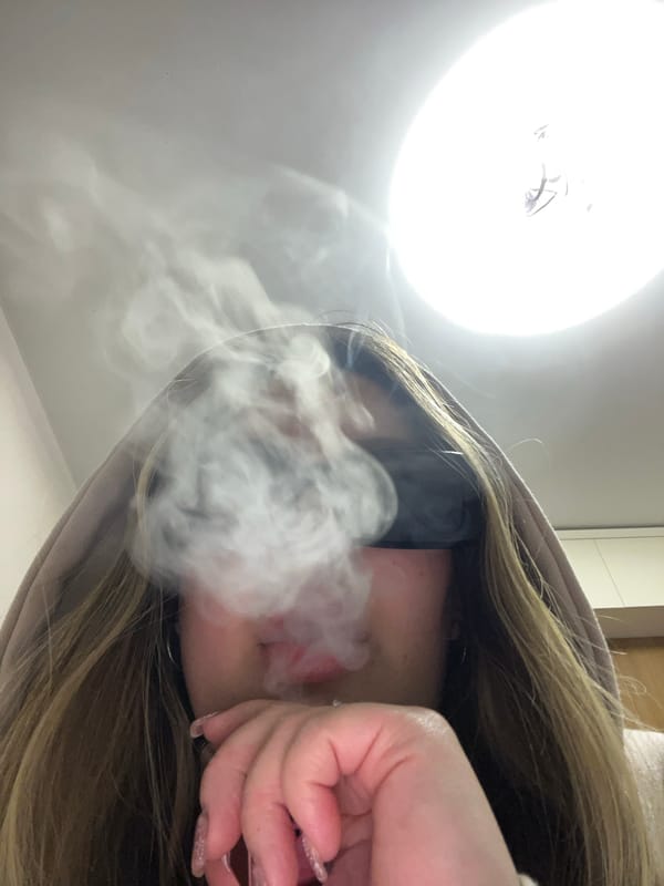 Young woman photographed vaping in Krasnodar evening