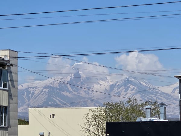 Early morning urban scenes documented across mountain-backdrop city