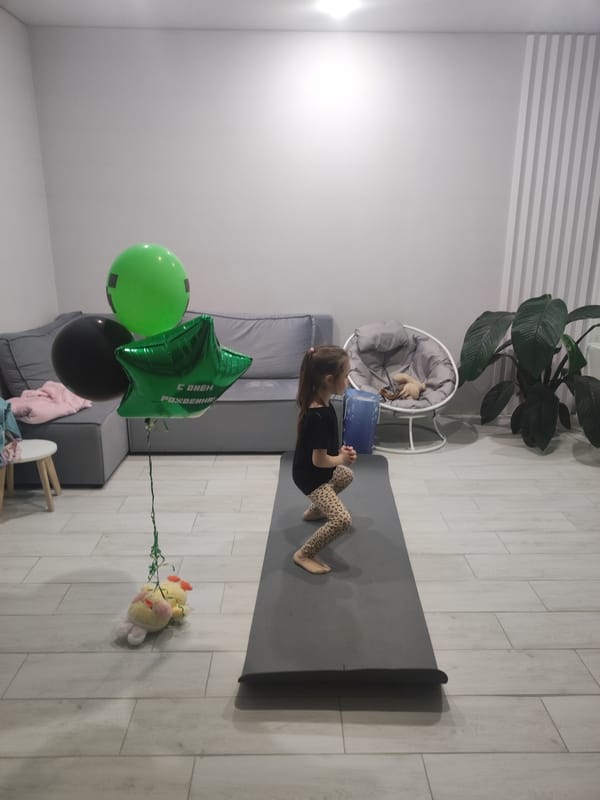 Girl exercises on yoga mat with balloons in Votkinsk