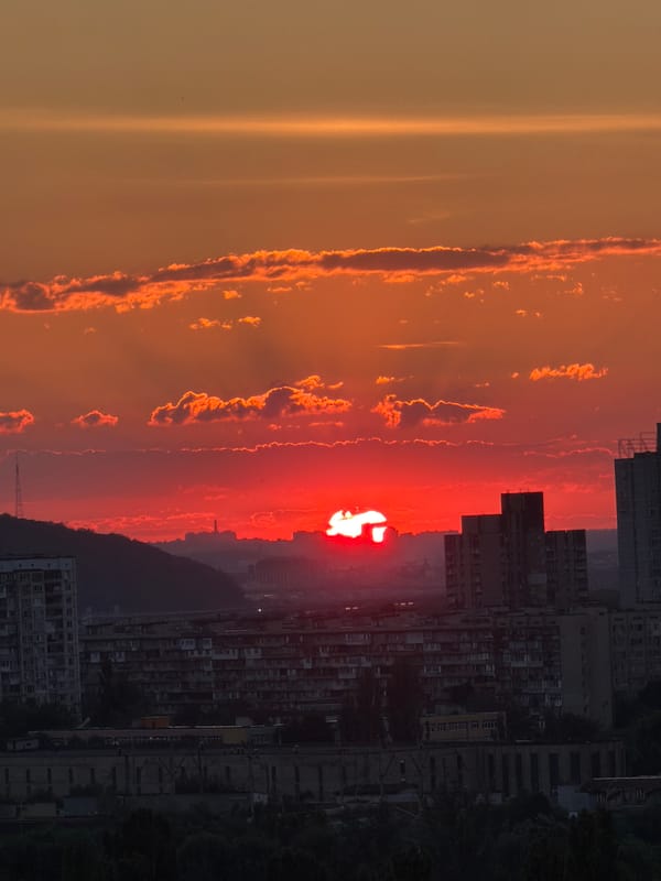 Kyiv residential neighborhood at golden hour, June 2026