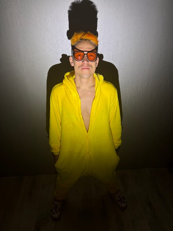 Person in yellow onesie photographed at Chaikovsky residence