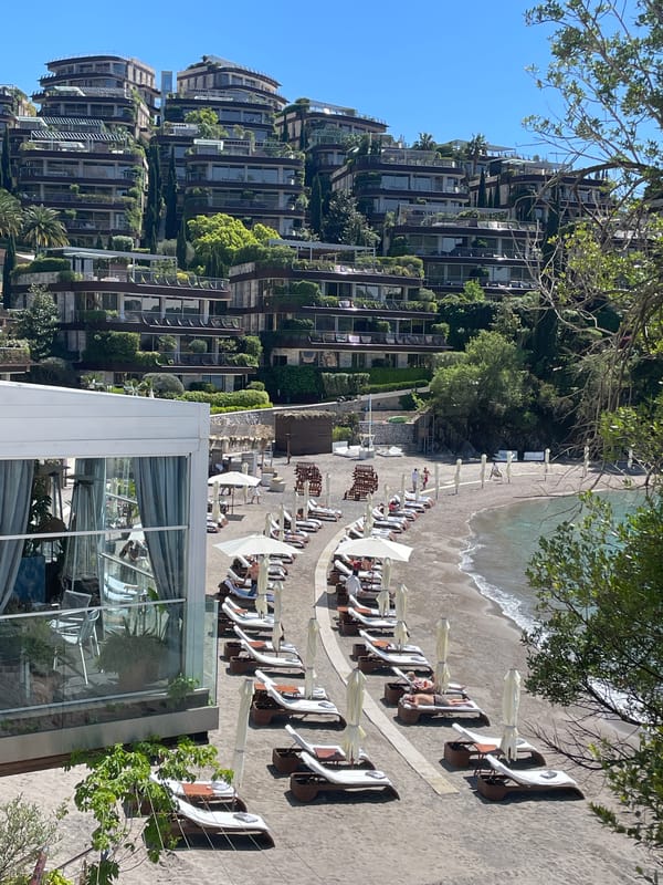 Tourists capture sunny beach scenes in Budva, Montenegro