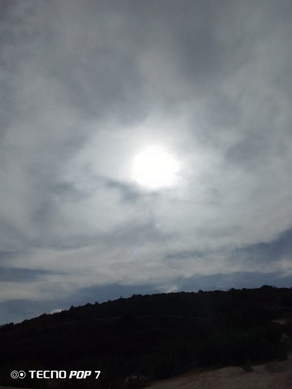 Sunlight breaks through overcast sky over Venezuelan landscape