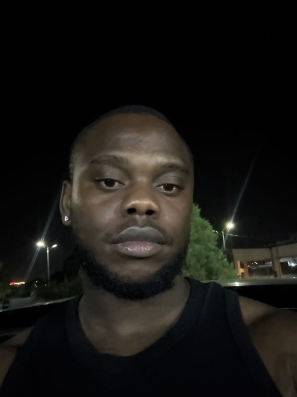 Man photographed twice in nighttime portraits in Lugbe, Nigeria