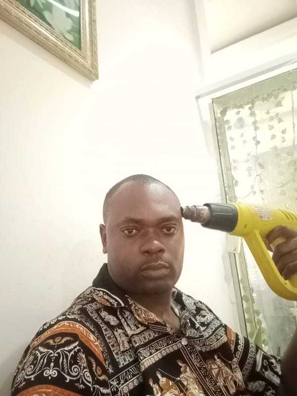 Man photographed with heat gun in Gwarinpa, Nigeria