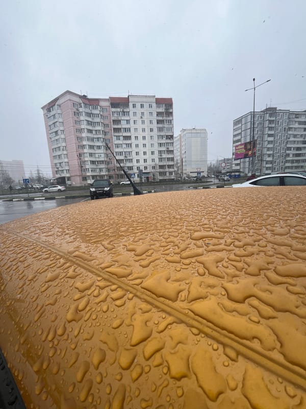 Rainy weather observed in Klin, Russia with tractor traffic