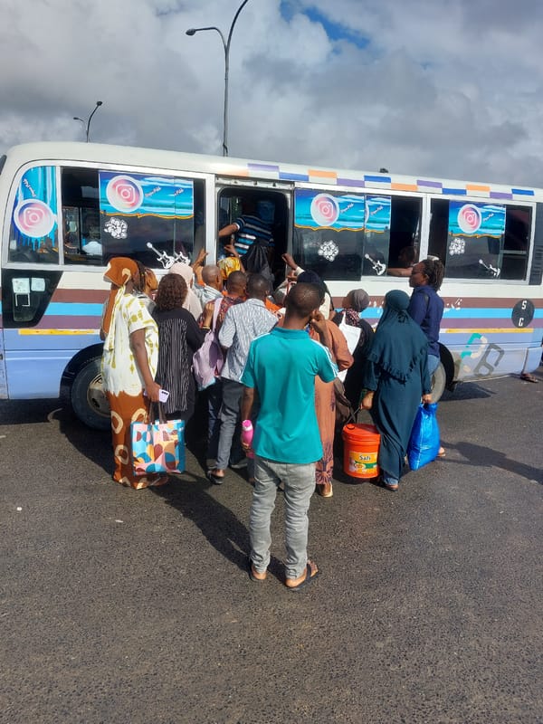 Morning commuter activity with dala-dala buses in Dar es-Salaam