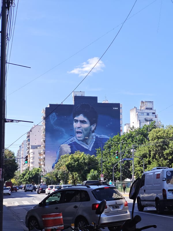 Ordinary Buenos Aires moments captured: subway, street dog, Maradona mural