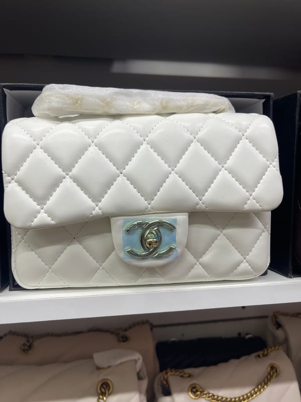 Luxury handbags and tactical gear side by side in Moscow retail