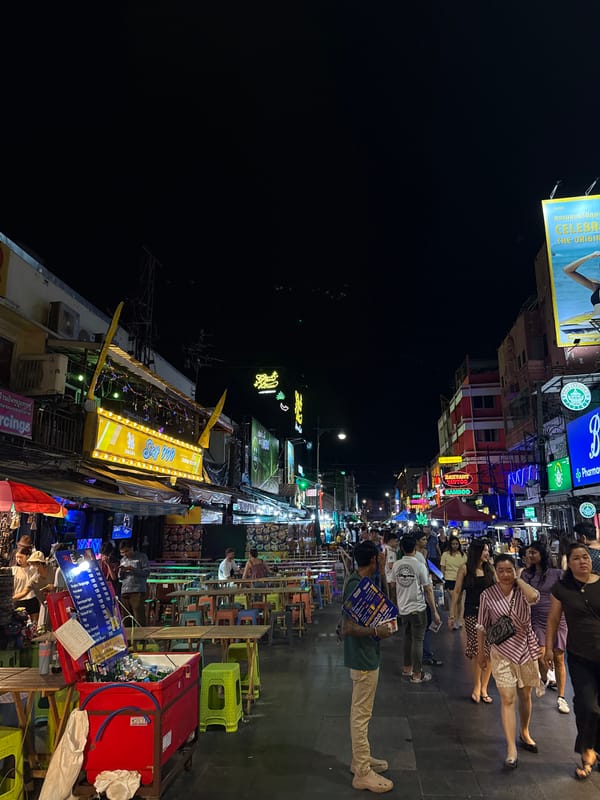 Khao San Road buzzing at night with street food and neon