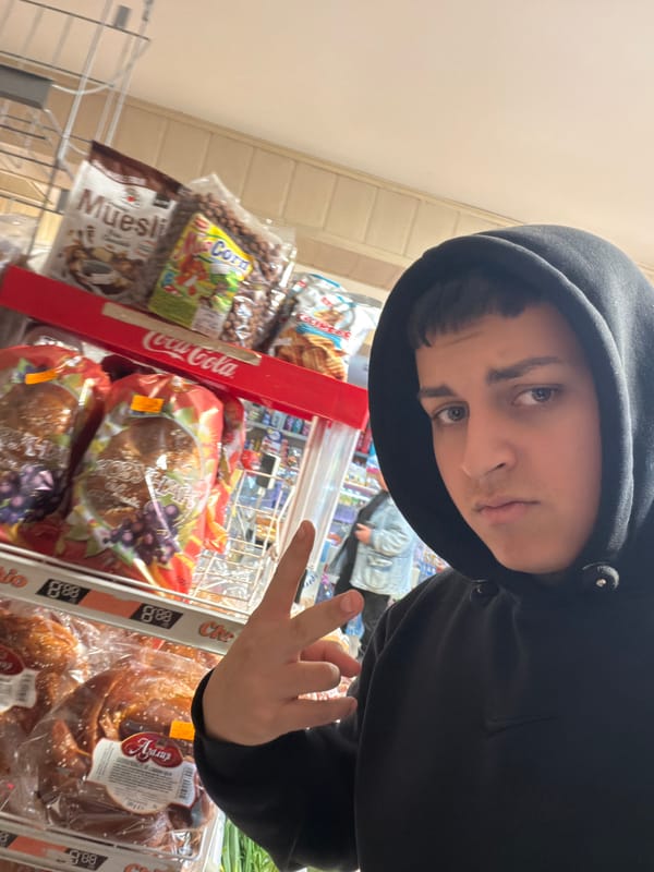 Person takes selfies with rock gestures in Bulgarian grocery store