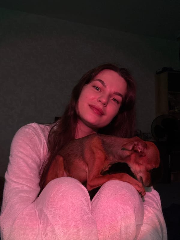 Woman documents selfie session with pet dog in Chaikovsky
