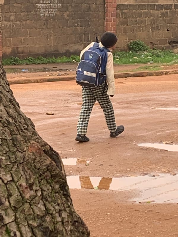 Morning street life in Bukuru, Nigeria — work, school, movement