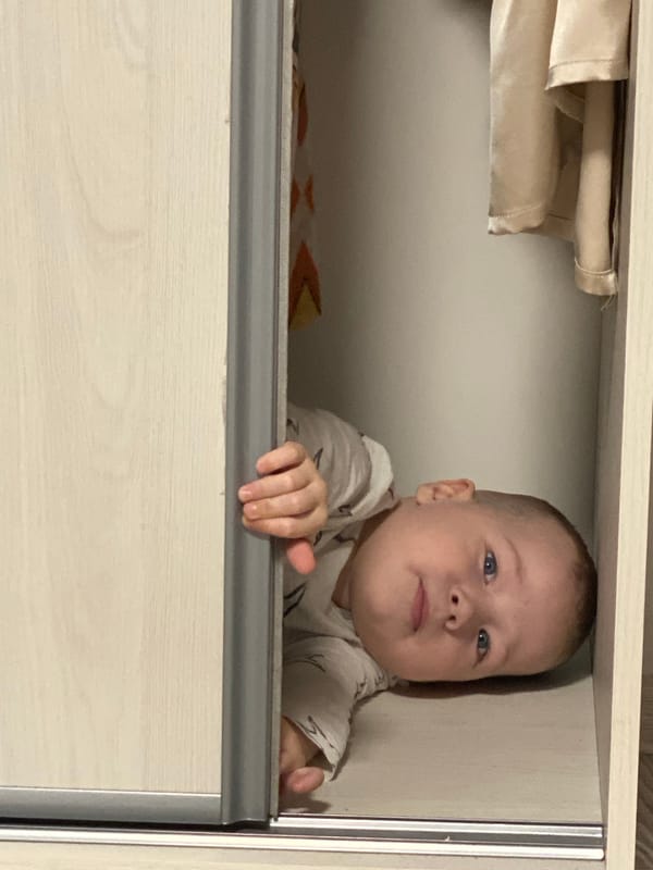 Child plays hide-and-seek in furniture at Sochi home