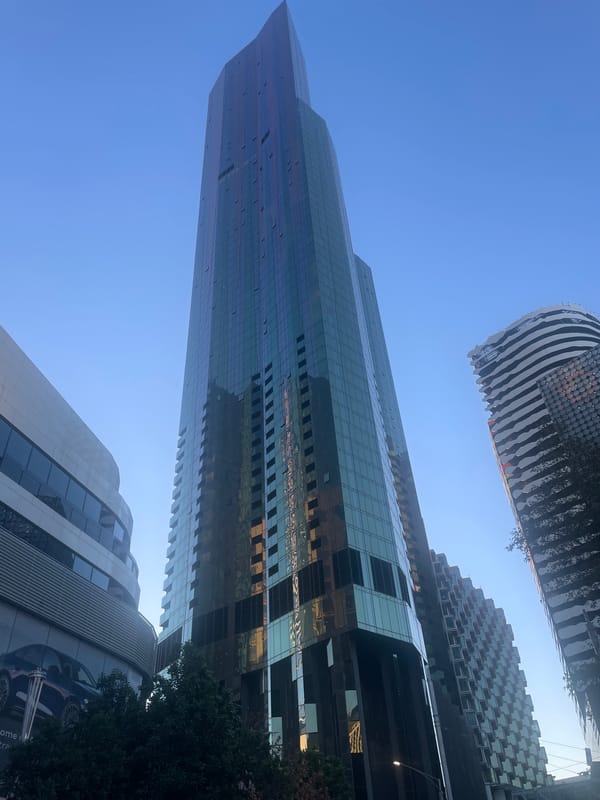 Eureka Tower rises against a clear Melbourne sky