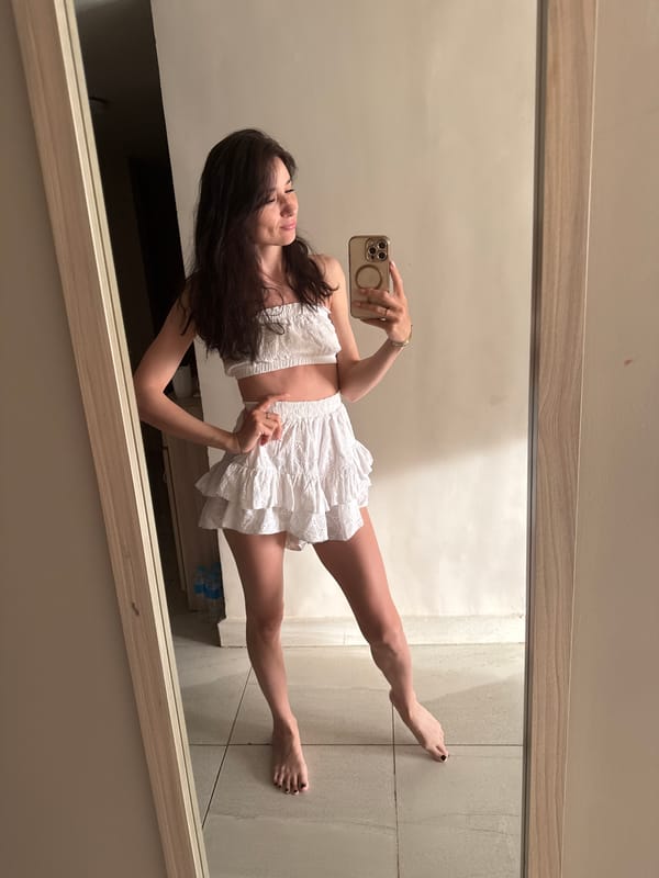 Woman takes mirror selfie in white outfit, Safaga Egypt