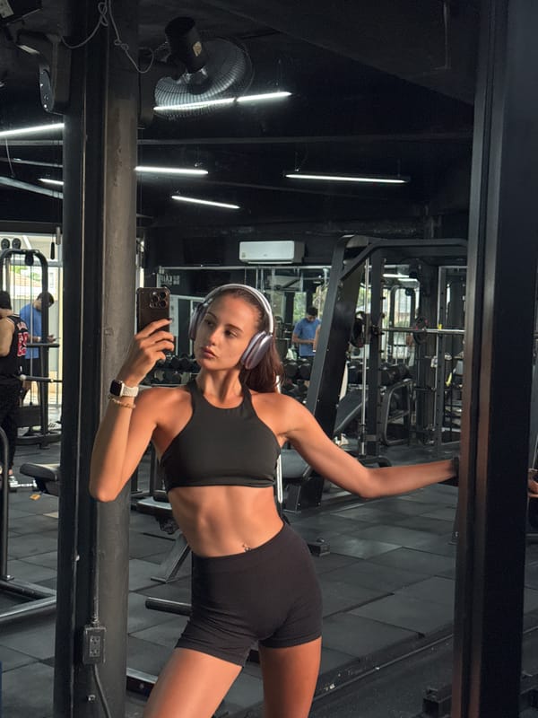 Woman takes gym selfies in Kathu, Thailand