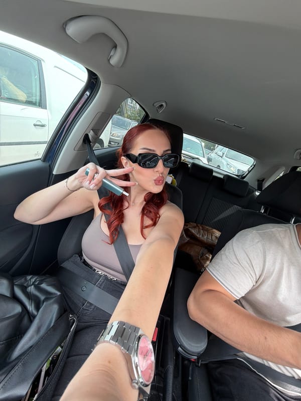 Two people photographed in car in Sofia, Bulgaria