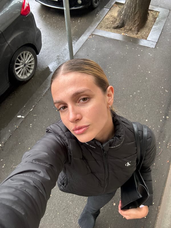 Woman takes cheerful selfies in downtown Tbilisi