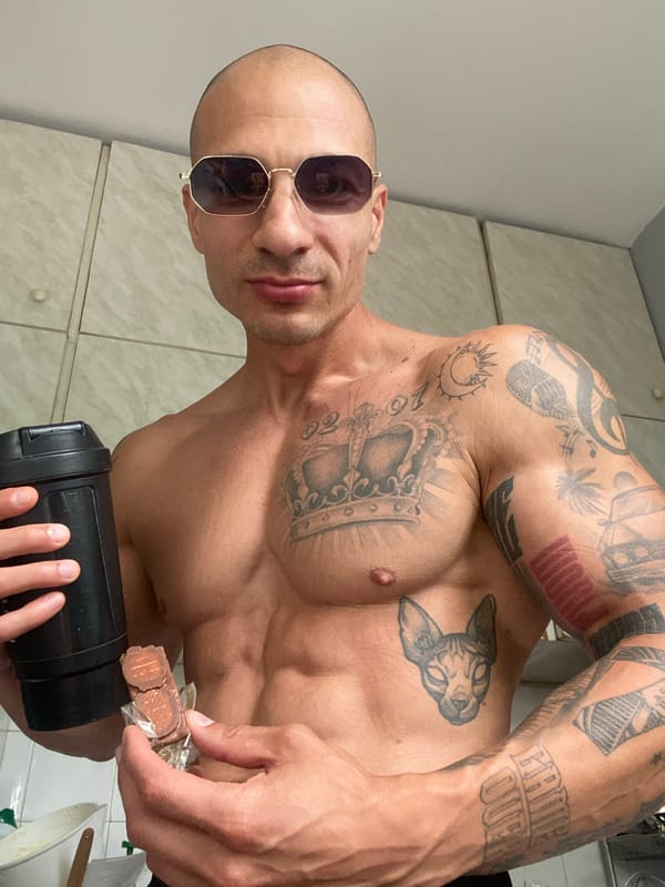 Shaker bottle and protein bar in hand, Pleven, Bulgaria