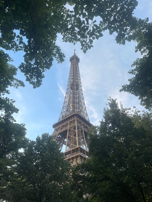 Eiffel Tower from multiple angles on a clear July evening