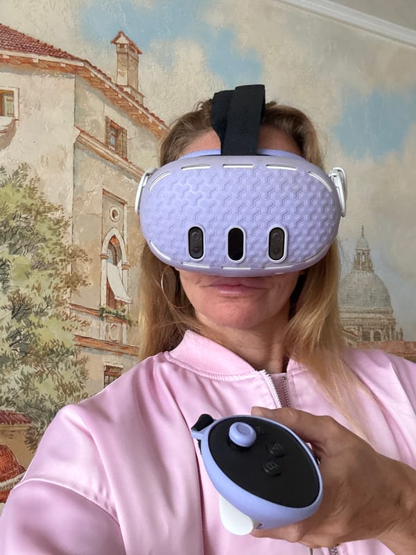 Person holds purple VR headset near building mural in Sinyavino