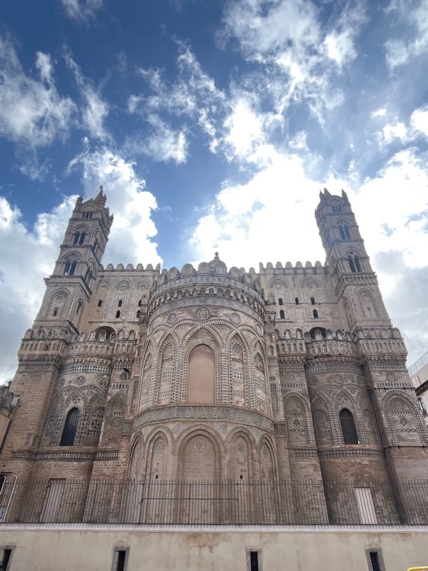 Tourist documents Palermo Cathedral and street art in Sicily