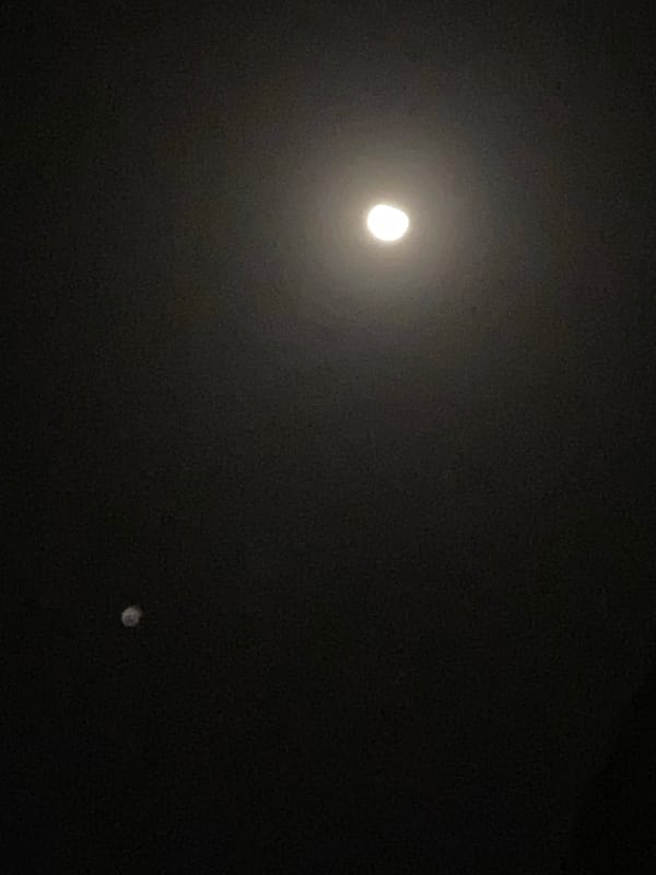 Crescent moon and unidentified object observed in Nigerian night sky