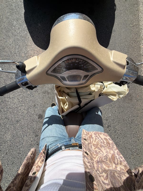 Scooter rider photographed in bright daylight in Ondara, Spain