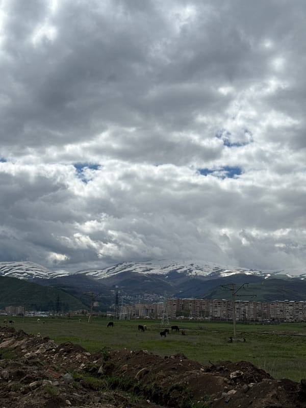 Cloudy skies over snow-covered mountains observed in Hrazdan, Armenia