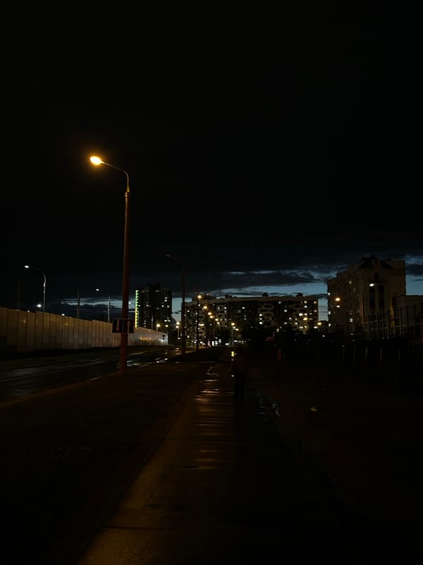 Evening lights illuminate Minsk streets and Svislach River