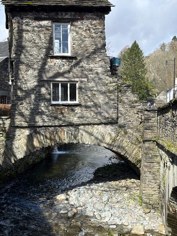 Tourist captures Bridge House and village scenes in Ambleside