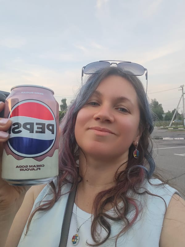 Woman poses with Pepsi cream soda in Russian village