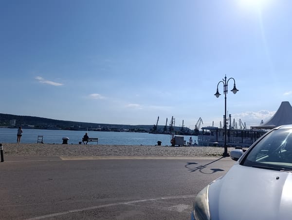 Lunch at a Varna waterfront restaurant, harbor promenade nearby.