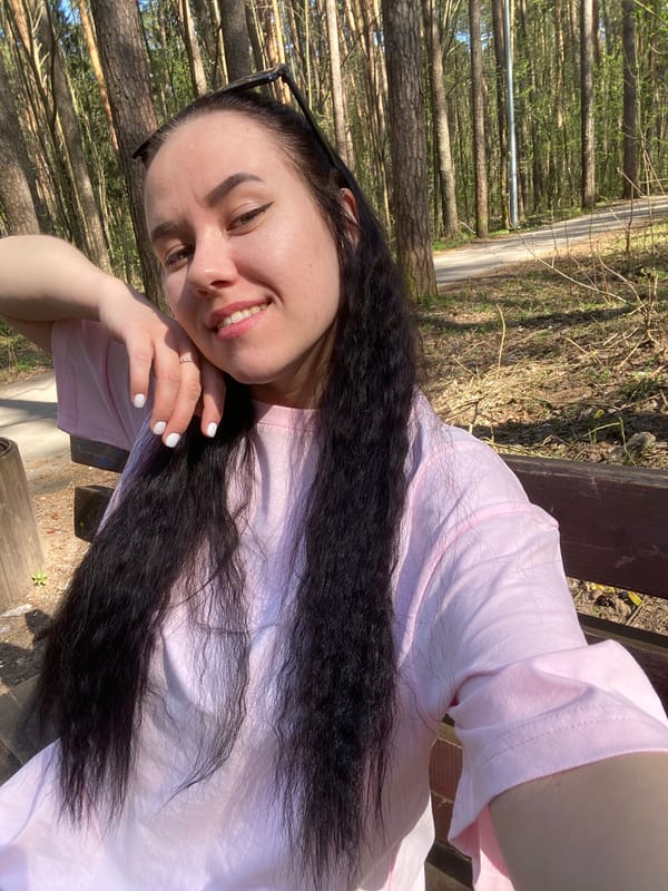 Woman takes selfie on park bench in Perm