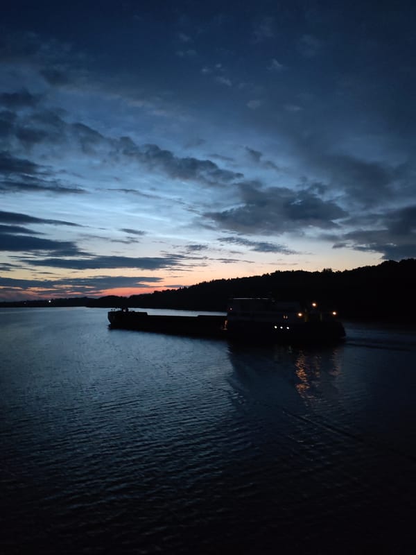 Barge on the river at dusk, Yakunina Gora