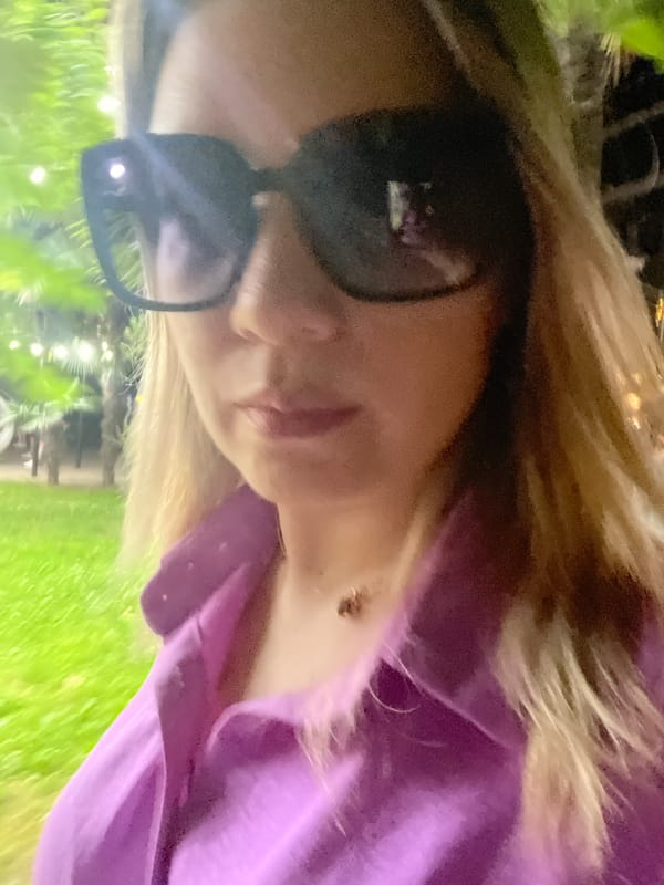 Sideways selfie in Sochi, sunglasses and purple top
