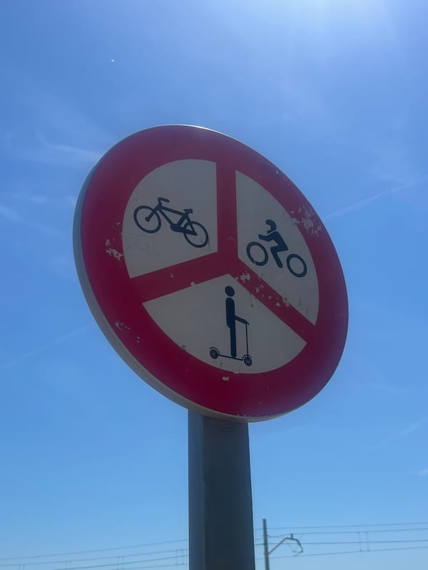 Backpacker explores Spanish coastal town Sant Pol de Mar